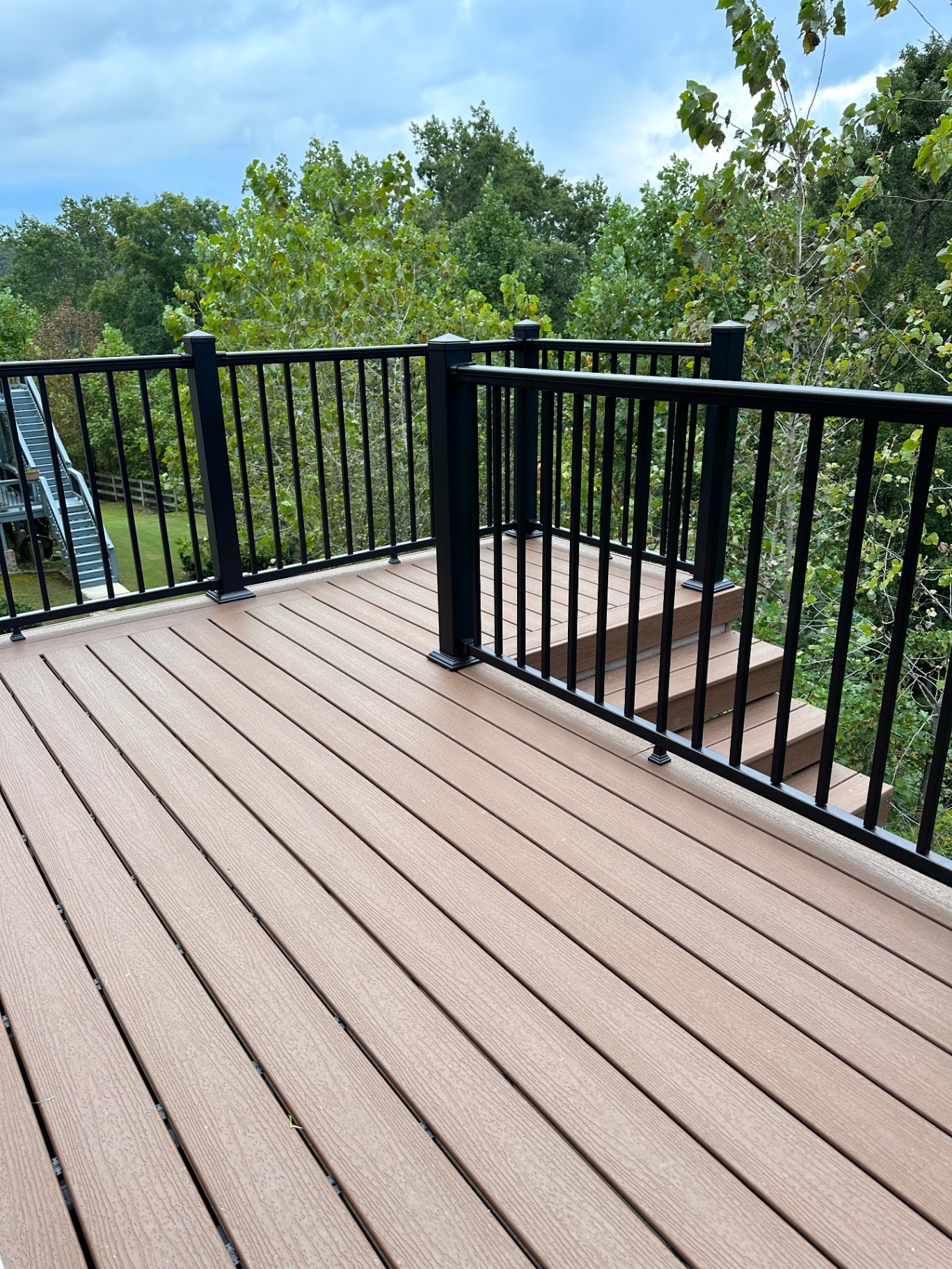 Composite deck with black aluminum railings